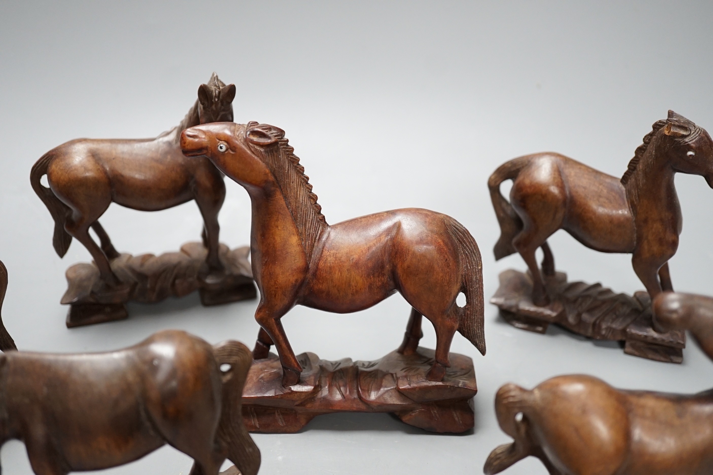 Seven Chinese hardwood models of horses. Tallest 13cm